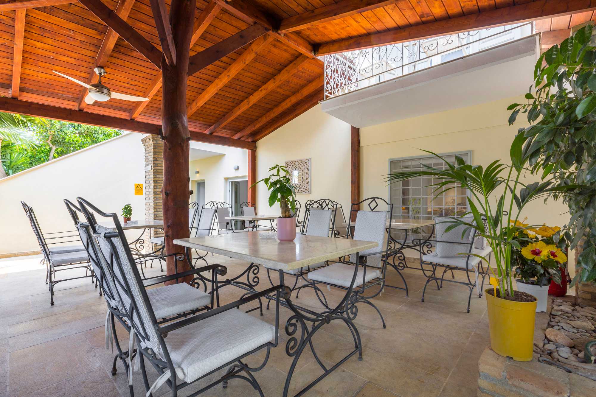 Breakfast laid out in the Mimoza courtyard, surrounded by garden greenery